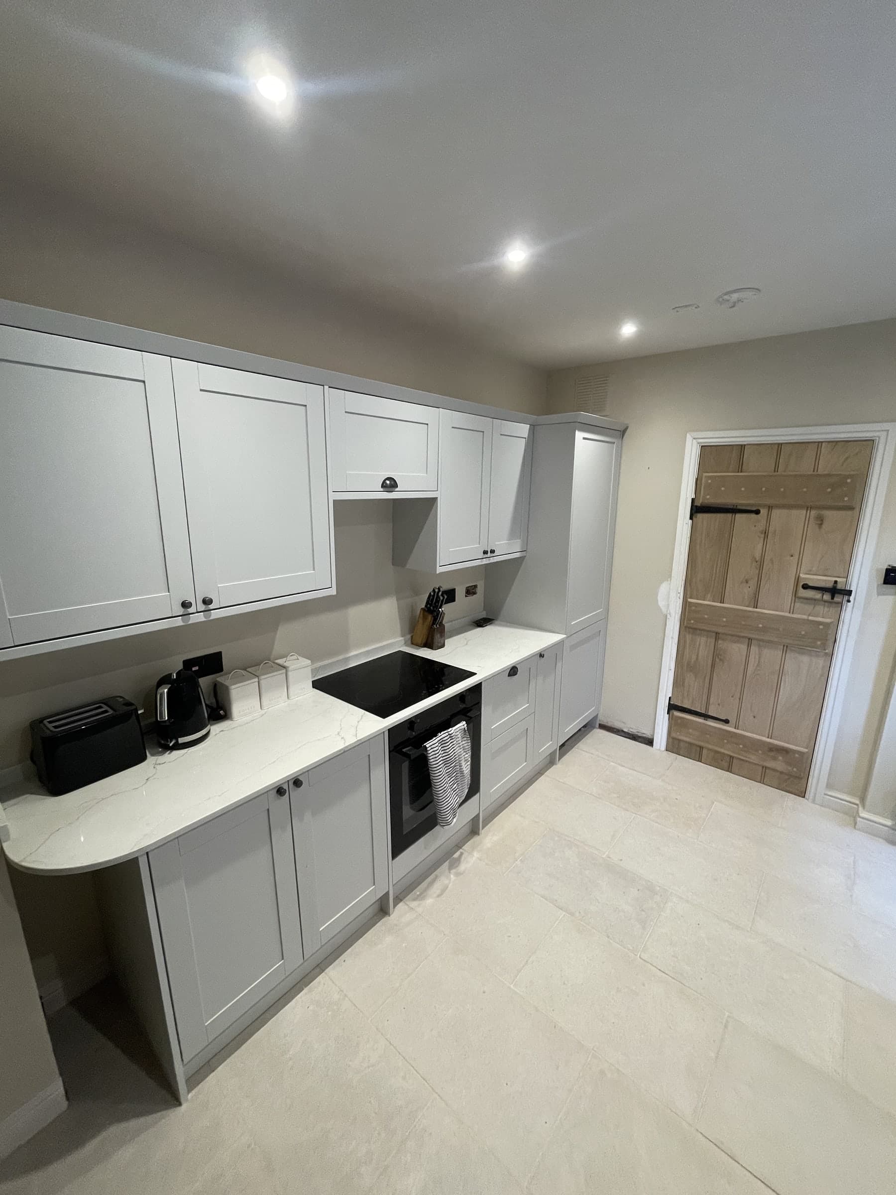 Completed kitchen renovation with fitted units and worktops
