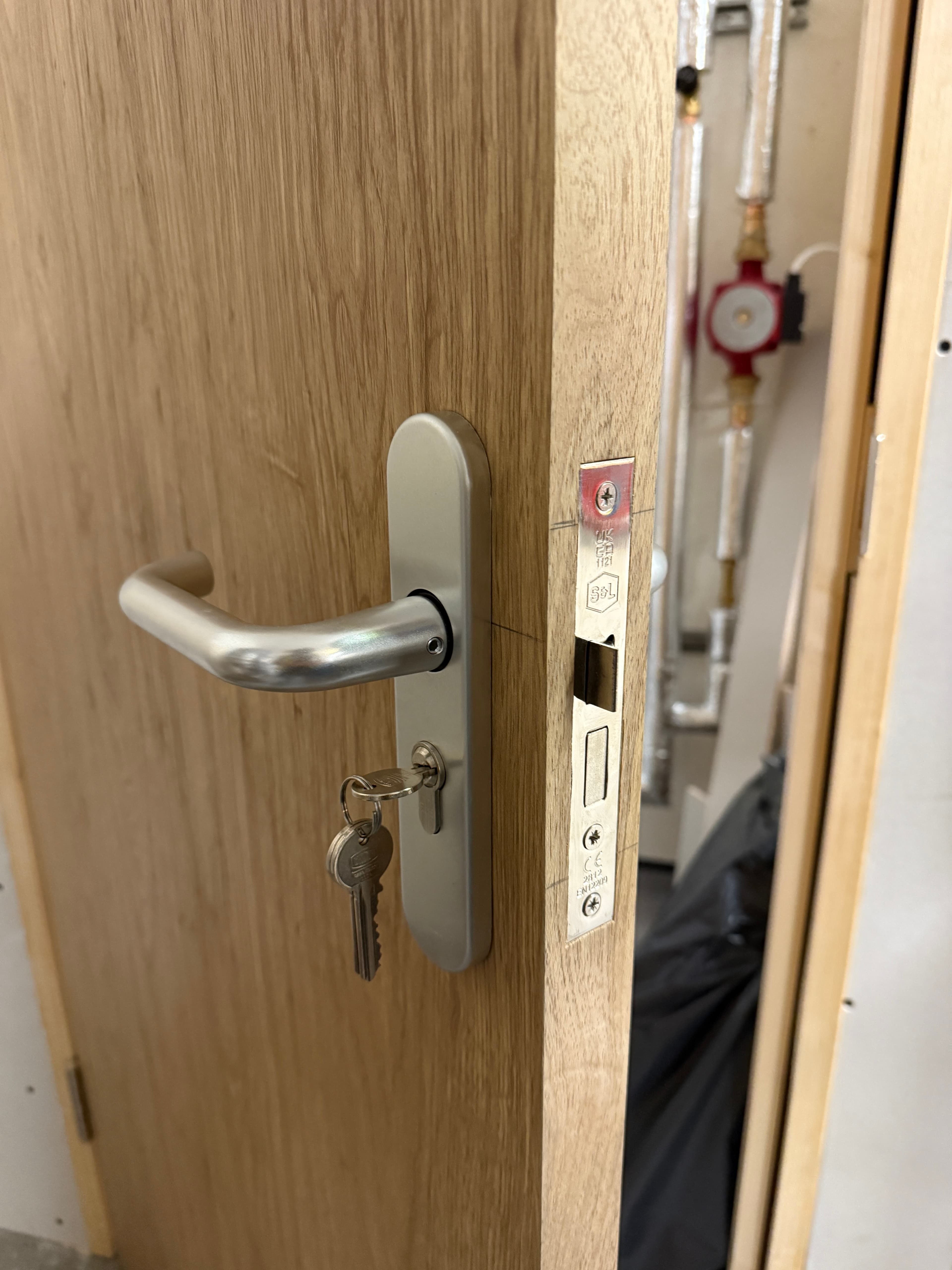 Oak internal door lockset and handle fitting detail