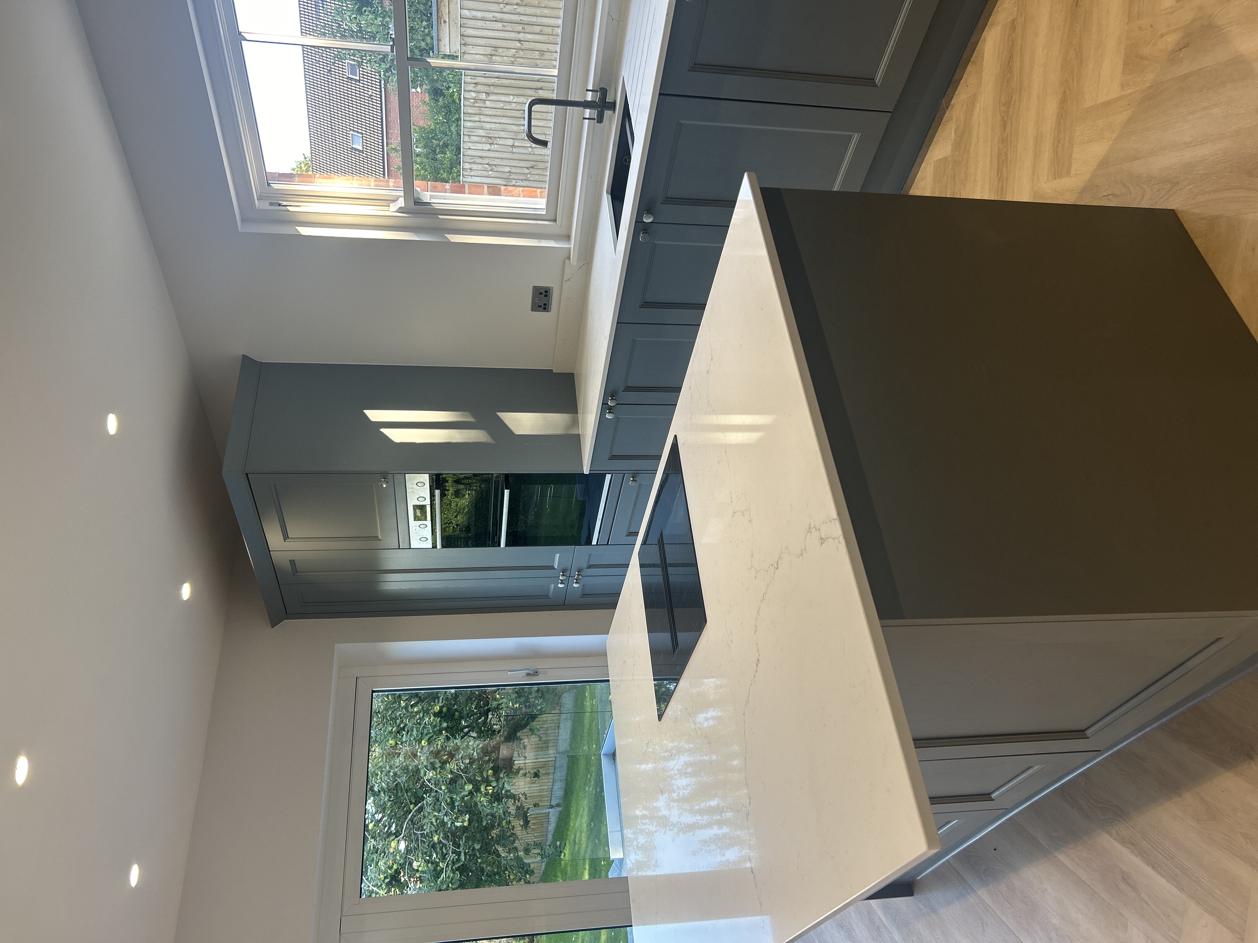 Grey shaker utility cabinet with sink and worktop