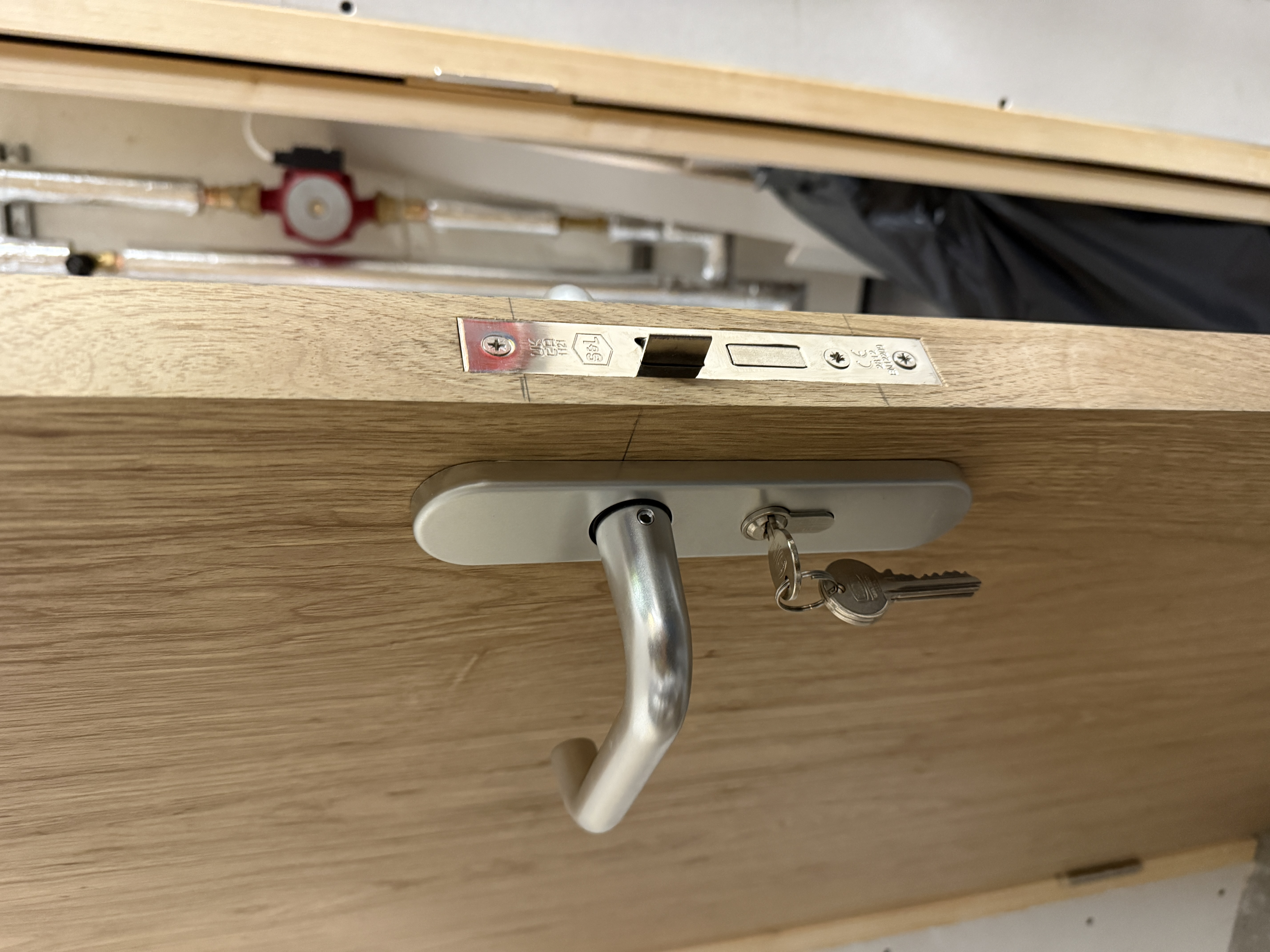 Oak internal door lockset and handle fitting detail